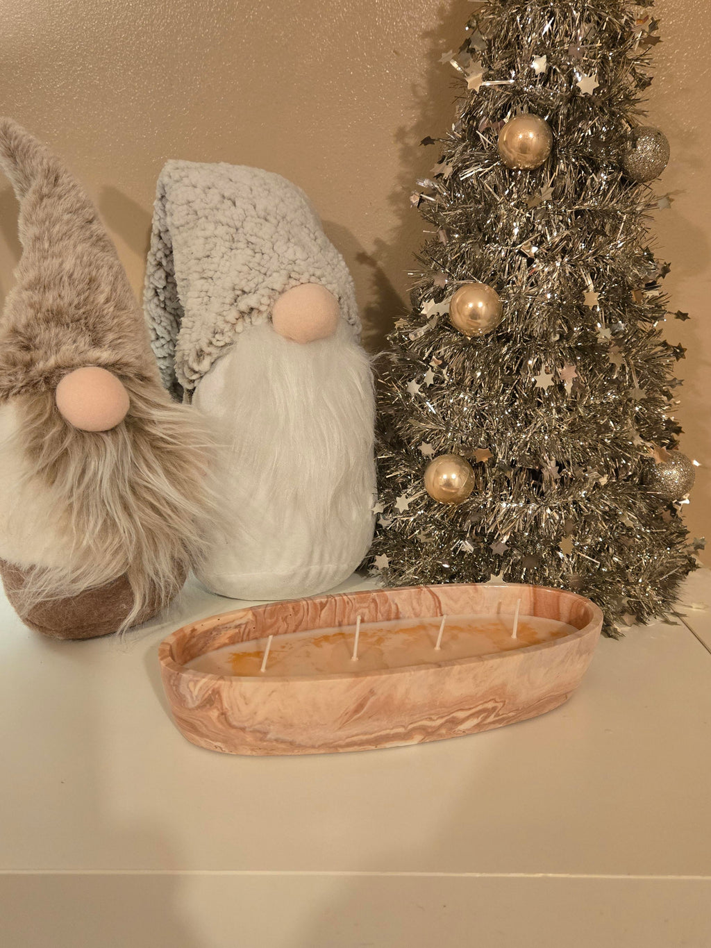 A beautiful Boat shaped handmade pot in a peach & white swirl effect, lovingly filled with our comforting Coffee Cake soy wax, giving off a warm sugary cake notes & a cosy, homely aroma.