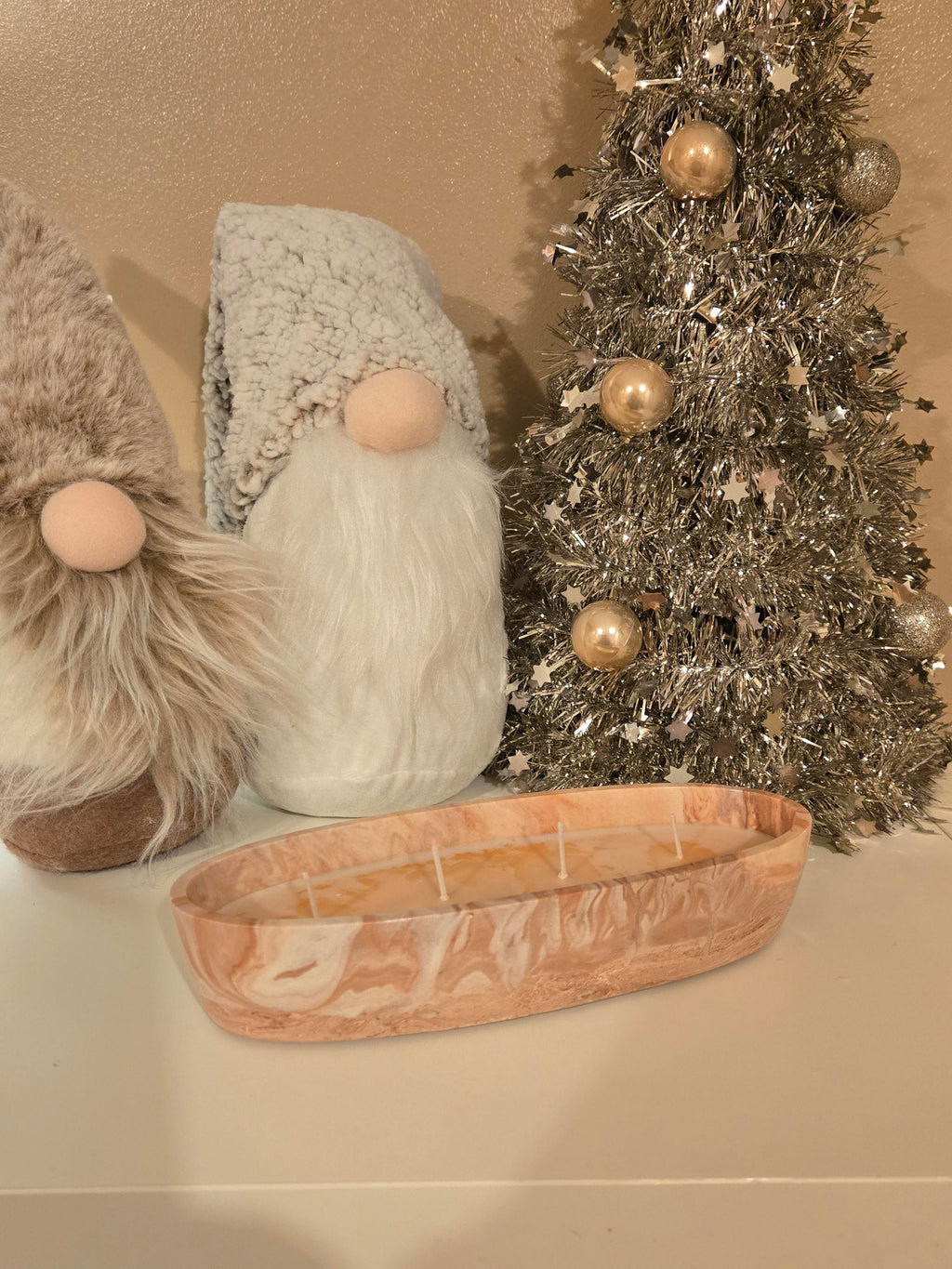 A beautiful Boat shaped handmade pot in a peach & white swirl effect, lovingly filled with our comforting Coffee Cake soy wax, giving off a warm sugary cake notes & a cosy, homely aroma.