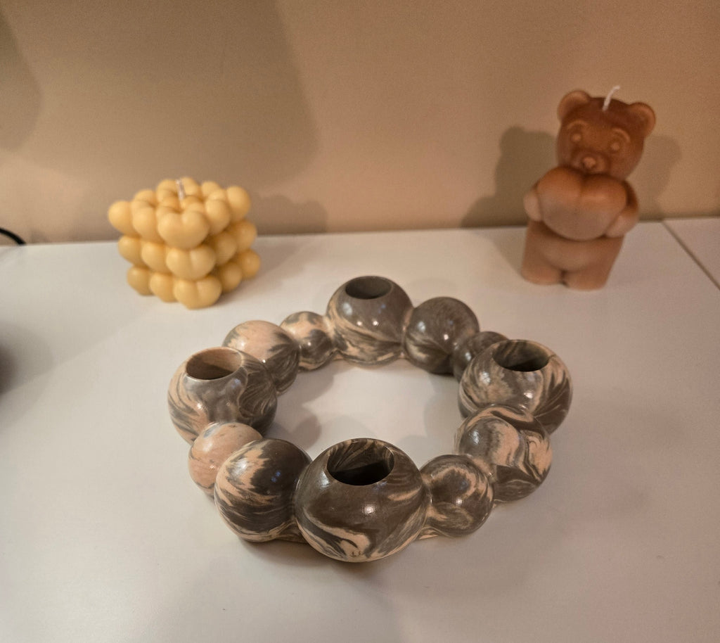 One of our favourite décor pieces.  A handcrafted marbled candle holder designed to bring warmth and style, Elegant • Versatile • Beautiful